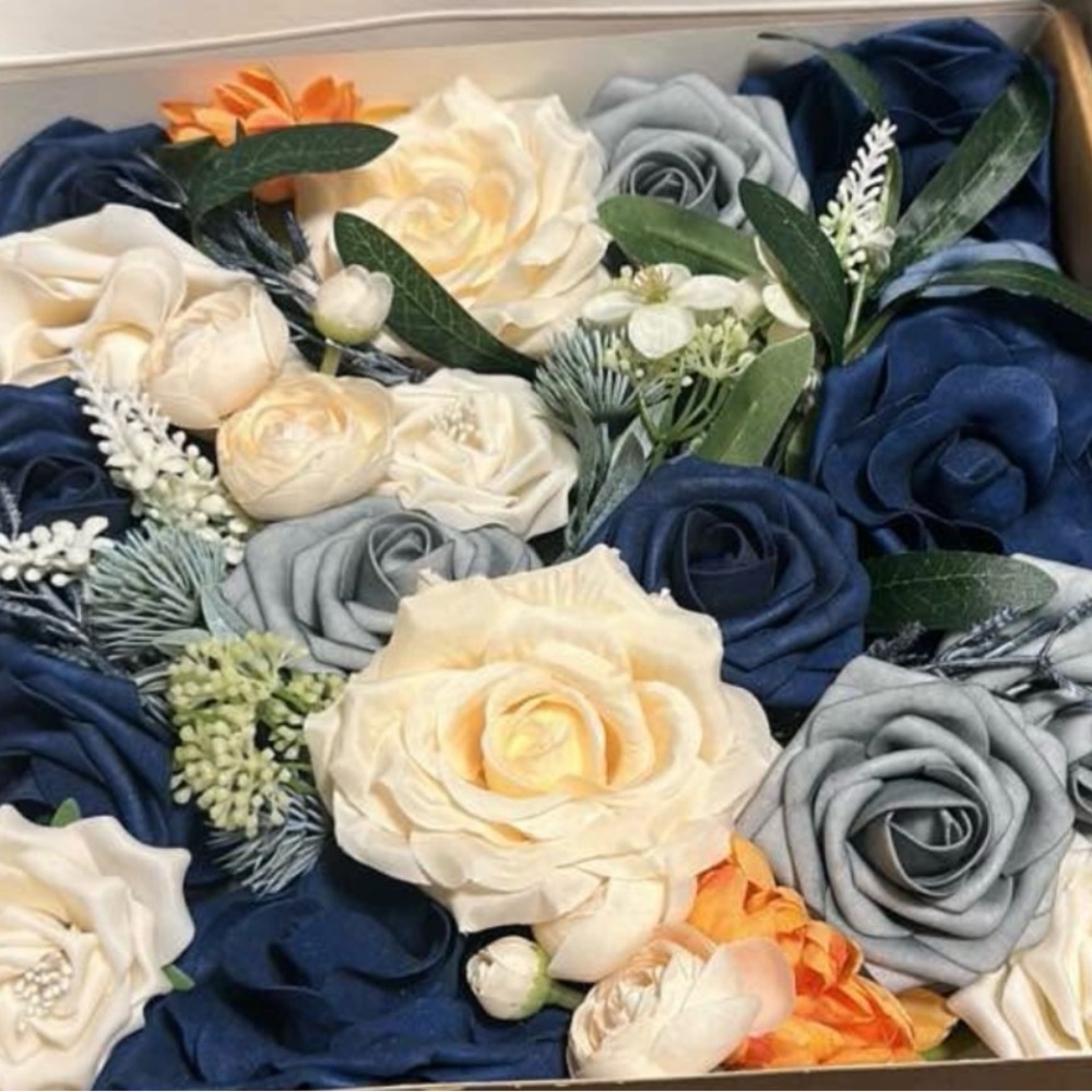 Elegant Floral Arrangement with Cream, Blue, and Orange Roses